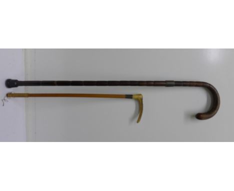 A bamboo walking stick and a riding crop, both with silver bands (2)