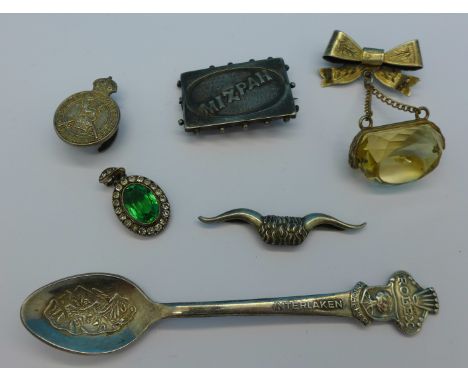 A Scottish silver bow brooch with applied fob drop, a silver Army Reserve badge, a Victorian silver Mizpah brooch, a paste pe