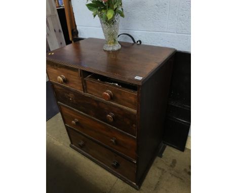 A mahogany chest of drawers and a large fire screen