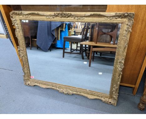 A vintage rectangular wall hanging mirror having an ornate moulded frame, 75cm h x 95cm wLocation: 
