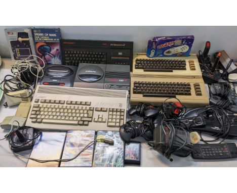 A selection of vintage gaming systems and accessories to include a Commodore A1200, Sega Mega Drive II, Sinclair 128K and oth