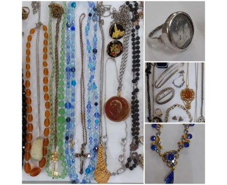 A quantity of vintage costume jewellery to include cross pendants, Aurora Borealis necklaces, coins, silver items to include 