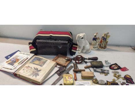 A mixed lot to include a Staffordshire Poodle, military badges, assorted tools, card albums and othersLocation: 