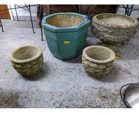 A group of four garden planters to include a pedestal neo-Classical style weathered concrete planter, a turquoise glazed hexa