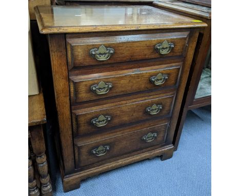 A vintage oak single door music cabinet in the form of a four drawer chest of drawers, 78.5cm h x 65cm wLocation: 