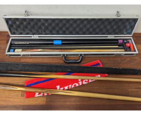 A group of three pool cues to include one cased example with accessories, one other E.J. Riley with long vintage case and ano