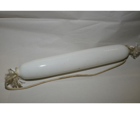 White glass rolling pin with remains of painted decoration