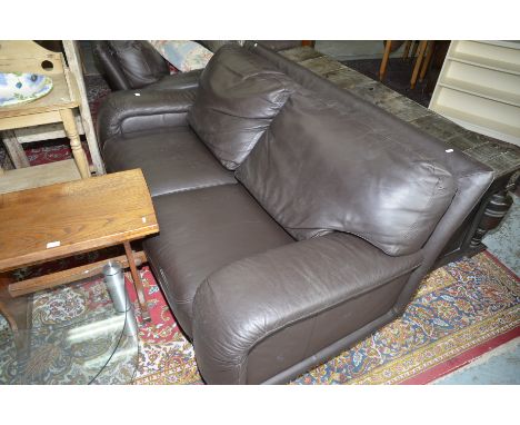 Two piece leather suite comprising of large two seat sofa and matching smaller two sofa