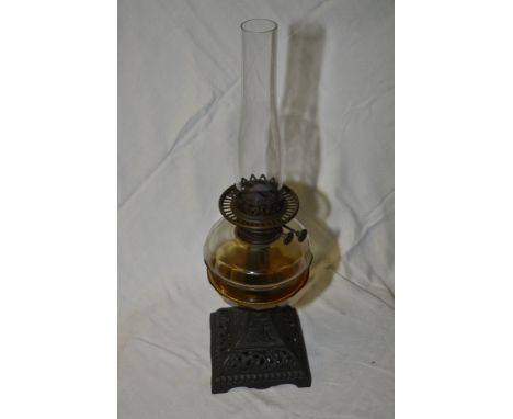 Cast paraffin lamp with clear glass resovoir