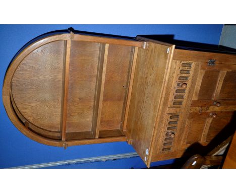 Light oak arched top dresser with two tier back above single drawers and two cupboard doors