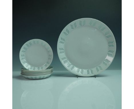 A refined 7-piece porcelain plate set designed by renowned ceramic artist Friedl Holzer-Kjellberg for Arabia Finland. Crafted