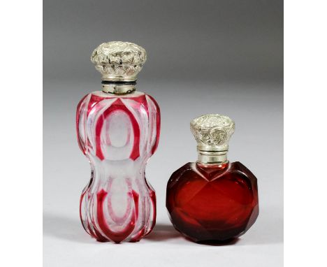 A late Victorian red overlay cut-glass silver mounted scent bottle, 4ins, and another of ruby tint, 2.5ins