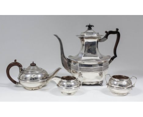 A late Victorian silver coffee pot of octagonal panelled form, the serpentine rim with gadroon mounts and with reeded band to