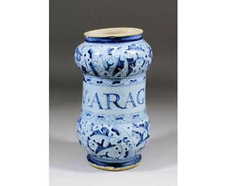 A late 17th Century Italian Marchigian maiolica berrettino albarello, painted in shades of blue with stylized leaves, the cen