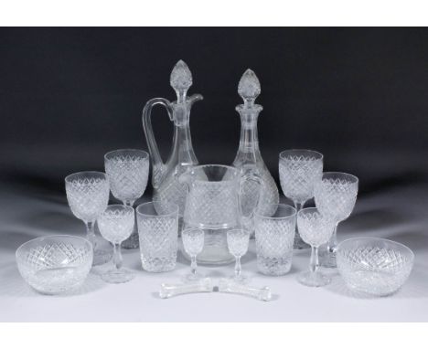 A diamond cut-glass table suite for six place setting, together with a matching claret jug and decanter, 10.5ins and 11.25ins