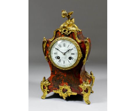 A late 19th Century French red tortoise-shell, Boulle and gilt brass mounted mantel clock of Louis XV design, No. 13607, reta