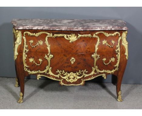 A 20th Century French rosewood and ormolu mounted bombe shaped commode of Louis XV design, inlaid with floral ornament, with 