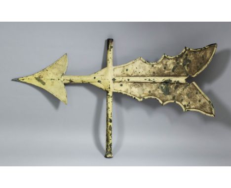 A 19th Century cream painted copper weather vane modelled as a flighted arrow, 18ins high x 31.5ins wide (some damage)