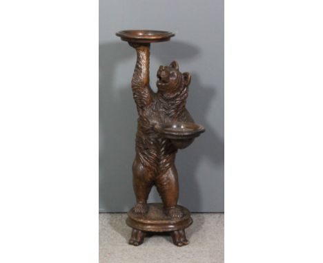 A late 19th Century "Black Forest" carved lindenwood bear pattern "Dumb Waiter" modelled in the form of a standing bear holdi