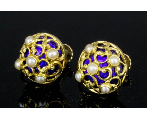 A pair of late Victorian gold coloured metal mounted enamel and seed pearl earrings (with screw fittings), the cabochon faces