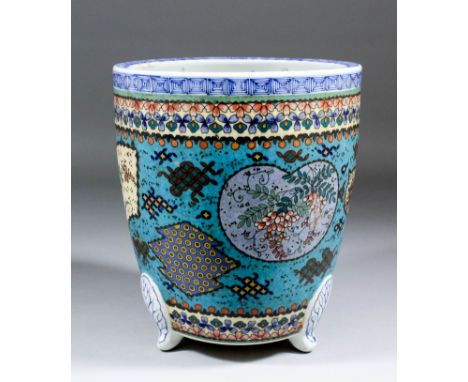 A Japanese blue and white porcelain jardiniere, the cloisonne centre band decorated with insects and flowers within shaped re