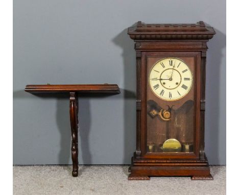 A late 19th Century American walnut cased shelf or bracket clock, the 8ins diameter cream painted dial to the two train movem