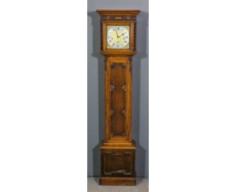 A 1920s oak cased "Grandmother" clock, the 8.5ins square brass dial with silvered chapter ring with Roman and Arabic numerals