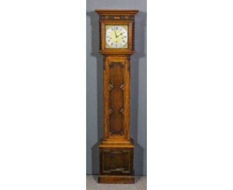 A 1920s oak cased "Grandmother" clock, the 8.5ins square brass dial with silvered chapter ring with Roman and Arabic numerals