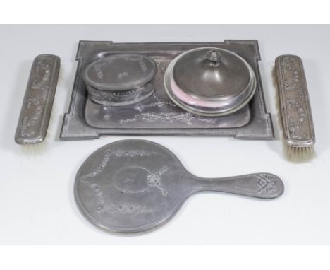 An Edward VII and George V Harlequin silver five piece dressing table set of Neo-classical design with bead mounts and cast w