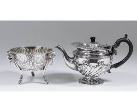 A Victorian silver bachelors circular teapot with shaped rim, the lid and body with part spiral reeded bead and floral orname