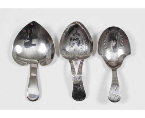 A George III silver caddy spoon with cartouche shaped bowl and pierced handle engraved with floral ornament by J.L. (?), Birm