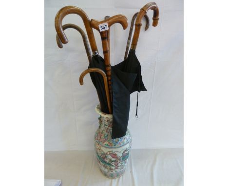 Silver top walking stick, umbrellas etc in Chinese vase (broken) 