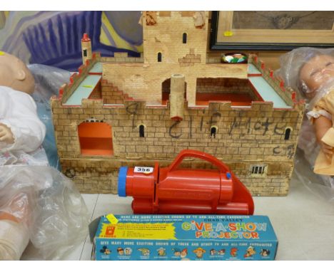 Vintage toy fort and a Chad Valley toy projector with a box of slides