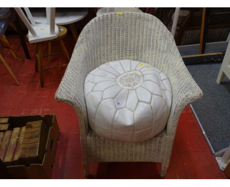 White loom style bedroom chair and a leather pouffe
