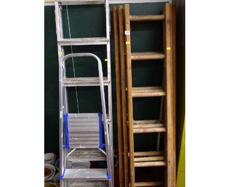 Metal threeway stepladder, smaller metal stepladder and a three section wooden ladder