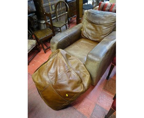 Vintage distressed leather armchair and pouffe
