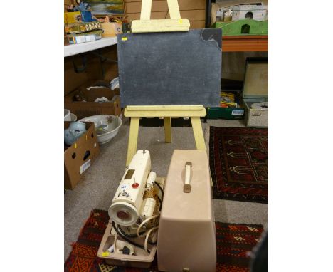 Vintage cased Singer sewing machine and a vintage easel with slate board