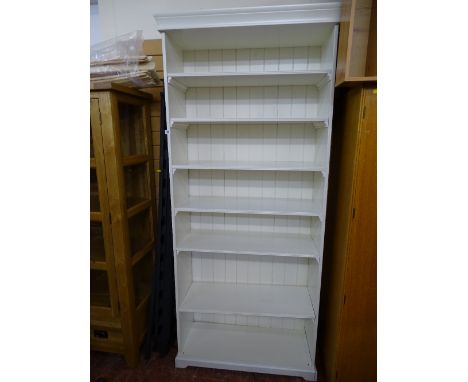 Tall white multi-shelf Ikea style bookcase