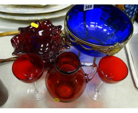 Bristol blue bowl on a brass stand with lion mask handles, a ruby glass bowl and a cranberry jug and two glasses