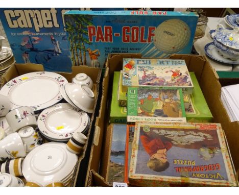 Box of vintage jigsaws and games including a Par-Golf by Ariel and a boxed carpet golf game