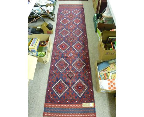Meshwani carpet runner, blue and red ground multi-diamond pattern with triple bordered ends, 262 x 63 cms