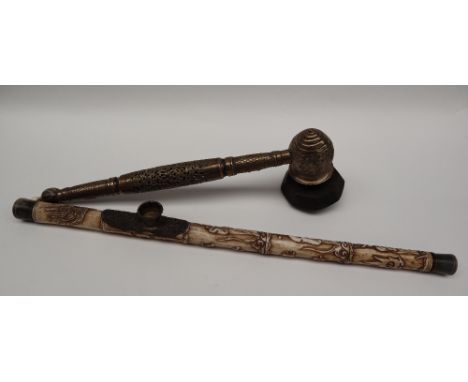 A Chinese brass opium pipe, with pierced and cast decoration, together with a bone example