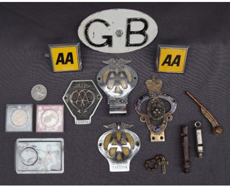 A collection of AA car badges together with a Royal British Legion car badge, commemorative coins, whistles etc 