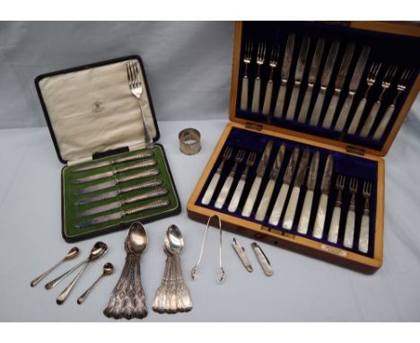 A set of six late Victorian silver tea spoons, London, 1896, together with other silver spoons, and sugar nips, approximately