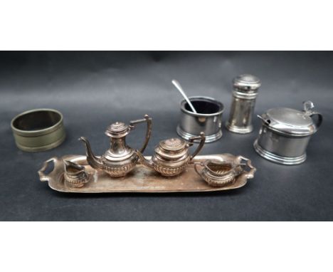 An Elizabeth II miniature silver five piece teaset with a tray, hot water pot, teapot, cream jug and sugar basin, Birmingham,