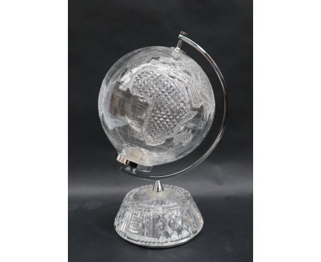 A Waterford crystal desk top World Globe with cut decoration, held aloft on a chrome plated support and cut glass base, 31cm 