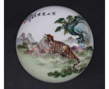 A Chinese porcelain box and cover, decorated with a tiger in a landscape, seal mark to the base, 14cm diameter CONDITION REPO