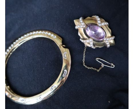 A rock crystal and seed pearl brooch, of pointed oval form, together with a gilt metal bangle
