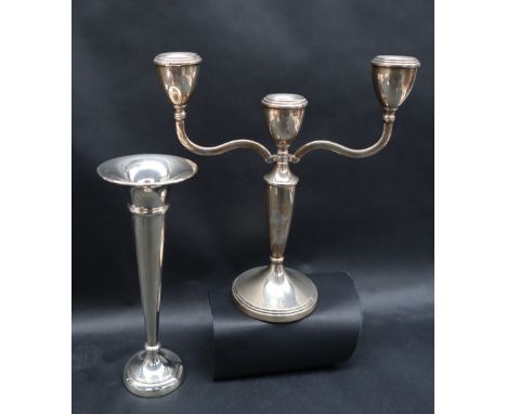 An Elizabeth II silver twin branch candlestick, Birmingham, 1972,23cm high  together with a silver bud vase, both with loaded