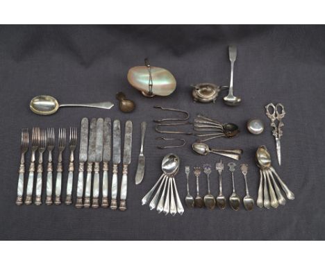 A George V silver dessert set, comprising a serving spoon and a set of six dessert spoons, Sheffield, 1920, C W Fletcher &amp